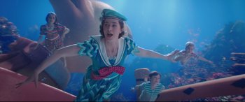 Movie still from “Mary Poppins Returns” (2018), directed by Rob Marshall – Two young children are underwater in costumes; Medium shot, High angle