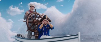 Movie still from “Mary Poppins Returns” (2018), directed by Rob Marshall – A man in a sailor's uniform and a man in a captain's uniform on a boat; Wide shot, Low angle