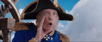 Movie still from “Mary Poppins Returns” (2018), directed by Rob Marshall – An old man wearing a pirate hat and a blue coat; Close Up shot, Low angle