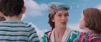 Movie still from “Mary Poppins Returns” (2018), directed by Rob Marshall – A person wearing a hat; Close Up shot, Over the shoulder angle