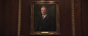 Movie still from “Mary Poppins Returns” (2018), directed by Rob Marshall – A painting of a man in a suit and tie; Medium shot, Low angle