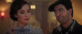 Movie still from “Mary Poppins Returns” (2018), directed by Rob Marshall – A man and a woman standing next to each other; Close Up shot, Over the shoulder angle
