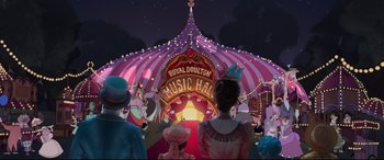 Movie still from “Mary Poppins Returns” (2018), directed by Rob Marshall – People are standing in front of a circus tent; Extreme Wide shot, Low angle