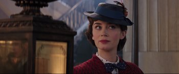 Movie still from “Mary Poppins Returns” (2018), directed by Rob Marshall – A woman with a bow tie and a blue hat; Close Up shot, Over the shoulder angle