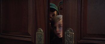 Movie still from “Mary Poppins Returns” (2018), directed by Rob Marshall – A group of people standing next to each other in a room; Close Up shot, Low angle