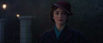 Movie still from “Mary Poppins Returns” (2018), directed by Rob Marshall – A woman in a purple hat and a blue coat; Close Up shot, Low angle