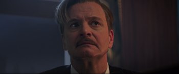 Movie still from “Mary Poppins Returns” (2018), directed by Rob Marshall – A person wearing a suit and tie; Close Up shot, Low angle