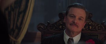 Movie still from “Mary Poppins Returns” (2018), directed by Rob Marshall – A person wearing a suit and tie; Close Up shot, Low angle