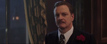 Movie still from “Mary Poppins Returns” (2018), directed by Rob Marshall – A person wearing a suit and tie; Close Up shot, Low angle