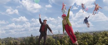 Movie still from “Mary Poppins Returns” (2018), directed by Rob Marshall – A couple of people that are in the air; Extreme Wide shot, Low angle