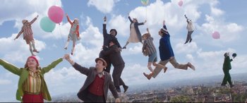 Movie still from “Mary Poppins Returns” (2018), directed by Rob Marshall – A group of people jumping in the air; Wide shot, Low angle