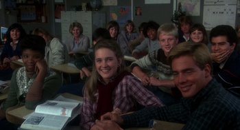 Movie still from “Mask” (1985), directed by Peter Bogdanovich – A group of people sitting in a classroom; Medium shot, High angle