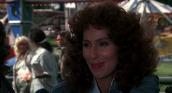 Movie still from “Mask” (1985), directed by Peter Bogdanovich – A person with curly hair; Close Up shot, Over the shoulder angle