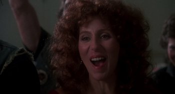 Movie still from “Mask” (1985), directed by Peter Bogdanovich – A person with curly red hair; Close Up shot, Low angle