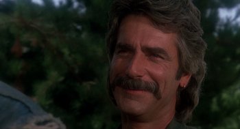 Movie still from “Mask” (1985), directed by Peter Bogdanovich – A person with a mustache; Close Up shot, Over the shoulder angle