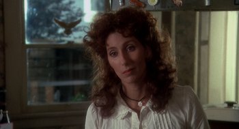 Movie still from “Mask” (1985), directed by Peter Bogdanovich – A person wearing a white shirt; Close Up shot, Over the shoulder angle