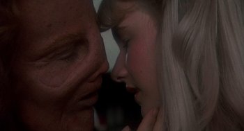 Movie still from “Mask” (1985), directed by Peter Bogdanovich – A man and a woman face to face; Extreme Close Up shot, Over the shoulder angle