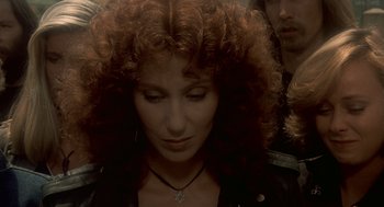 Movie still from “Mask” (1985), directed by Peter Bogdanovich – A person with curly red hair; Close Up shot, Low angle