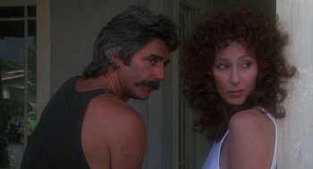 Movie still from “Mask” (1985), directed by Peter Bogdanovich – A man and a woman standing next to each other; Close Up shot, Low angle