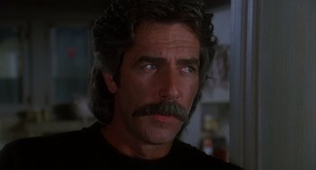 Movie still from “Mask” (1985), directed by Peter Bogdanovich – Close up of a man's face with a mustache; Close Up shot, Low angle