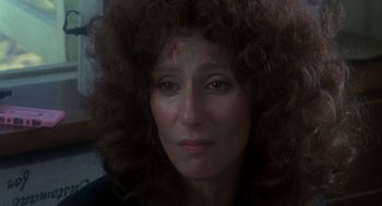 Movie still from “Mask” (1985), directed by Peter Bogdanovich – A person with a red spot on their forehead; Close Up shot, High angle