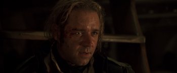 Movie still from “Master and Commander: The Far Side of the World” (2003), directed by Peter Weir – A person with a scar on his face; Close Up shot, Over the shoulder angle