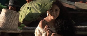 Movie still from “Master and Commander: The Far Side of the World” (2003), directed by Peter Weir – A young woman holding an umbrella over her head; Close Up shot, Over the shoulder angle
