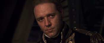 Movie still from “Master and Commander: The Far Side of the World” (2003), directed by Peter Weir – A person wearing a jacket; Close Up shot, Low angle