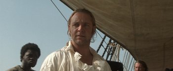 Movie still from “Master and Commander: The Far Side of the World” (2003), directed by Peter Weir – A person on a boat; Close Up shot, Low angle