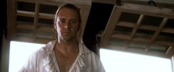 Movie still from “Master and Commander: The Far Side of the World” (2003), directed by Peter Weir – A person wearing a white shirt; Close Up shot, Low angle