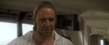 Movie still from “Master and Commander: The Far Side of the World” (2003), directed by Peter Weir – A person with long hair; Close Up shot, Over the shoulder angle