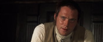 Movie still from “Master and Commander: The Far Side of the World” (2003), directed by Peter Weir – A person wearing a shirt and tie; Close Up shot, Over the shoulder angle
