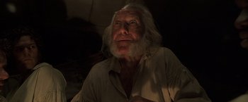 Movie still from “Master and Commander: The Far Side of the World” (2003), directed by Peter Weir – An old man with long white hair and a white beard; Close Up shot, Low angle