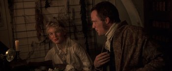 Movie still from “Master and Commander: The Far Side of the World” (2003), directed by Peter Weir – A man and a boy are looking at each other in a room; Close Up shot, Over the shoulder angle