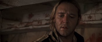 Movie still from “Master and Commander: The Far Side of the World” (2003), directed by Peter Weir – A person wearing a jacket; Close Up shot, Over the shoulder angle