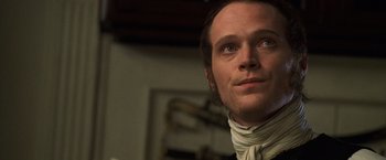Movie still from “Master and Commander: The Far Side of the World” (2003), directed by Peter Weir – A person wearing a neck scarf; Close Up shot, Low angle