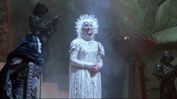 Movie still from “Masters of the Universe” (1987), directed by Gary Goddard – A woman dressed as the snow queen from the snow white movie; Medium shot, Low angle