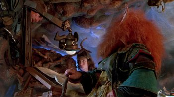 Movie still from “Masters of the Universe” (1987), directed by Gary Goddard – A man with horns and a red beard is holding a sword; Medium shot, Low angle