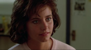 Movie still from “Masters of the Universe” (1987), directed by Gary Goddard – A person wearing a pink sweater; Close Up shot, Over the shoulder angle