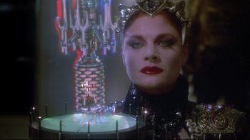 Movie still from “Masters of the Universe” (1987), directed by Gary Goddard – A person wearing a crown near a chandelier; Close Up shot, Low angle