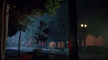 Movie still from “Masters of the Universe” (1987), directed by Gary Goddard – A city street at night in the dark; Extreme Wide shot, Low angle
