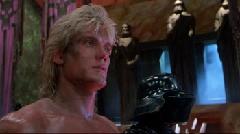 Movie still from “Masters of the Universe” (1987), directed by Gary Goddard – A person wearing a helmet; Close Up shot, Low angle