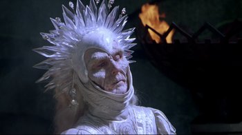 Movie still from “Masters of the Universe” (1987), directed by Gary Goddard – A woman with white makeup and a white head piece; Close Up shot, Low angle