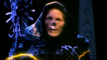 Movie still from “Masters of the Universe” (1987), directed by Gary Goddard – A person wearing a skull mask; Close Up shot, Low angle