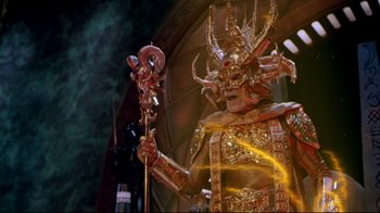 Movie still from “Masters of the Universe” (1987), directed by Gary Goddard – A man dressed as a demon holding a staff in his hand; Medium shot, Low angle