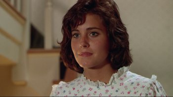 Movie still from “Masters of the Universe” (1987), directed by Gary Goddard – A young woman with brown hair wearing a white dress; Close Up shot, Over the shoulder angle