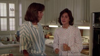 Movie still from “Masters of the Universe” (1987), directed by Gary Goddard – Two women standing next to each other in a kitchen; Medium shot, Low angle