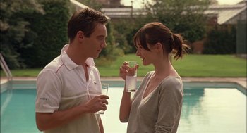 Movie still from “Match Point” (2005), directed by Woody Allen – A man and a woman standing next to each other; Medium shot, Over the shoulder angle