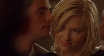 Movie still from “Match Point” (2005), directed by Woody Allen – A man and a woman are kissing in a room; Close Up shot, Over the shoulder angle
