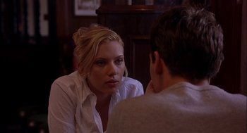 Movie still from “Match Point” (2005), directed by Woody Allen – A woman sitting next to a man in front of a mirror; Close Up shot, Over the shoulder angle